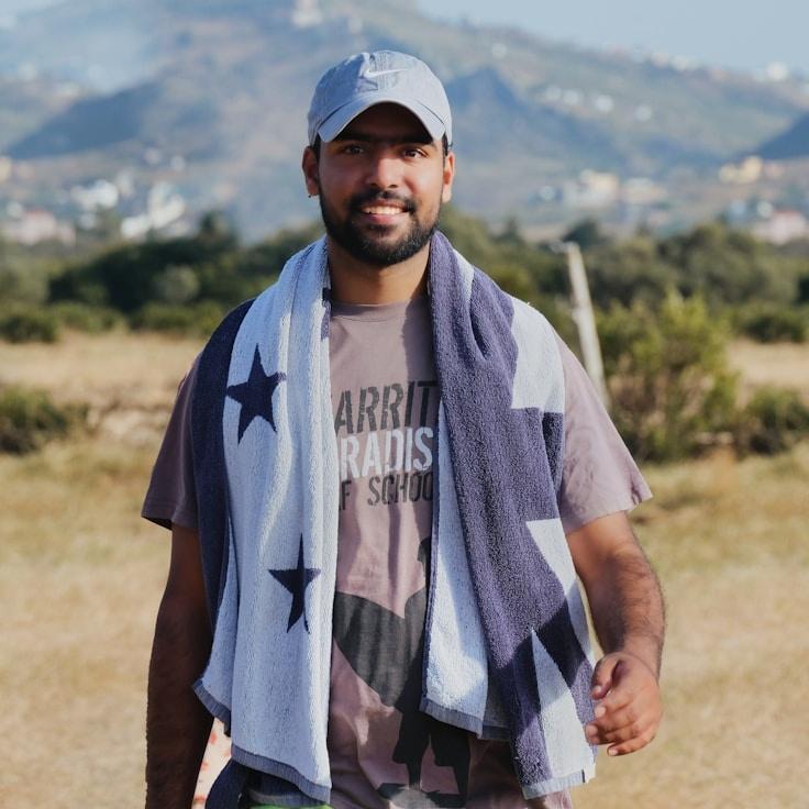 Kaveri Mehta, Lead Design Curator at Forest Paper Trail, reviewing corporate floral arrangements